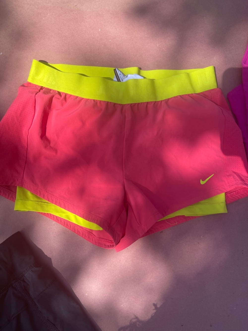 Nike Women's Pink Shorts with Neon Yellow Waistband